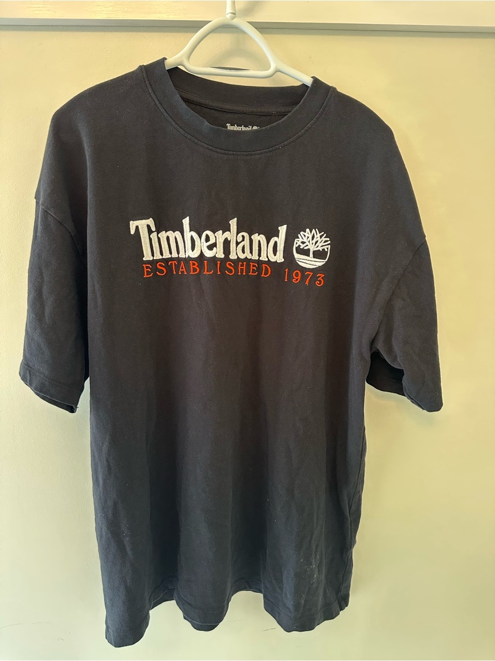 Timberland Black Short Sleeve Tee with White Logo and Orange Text